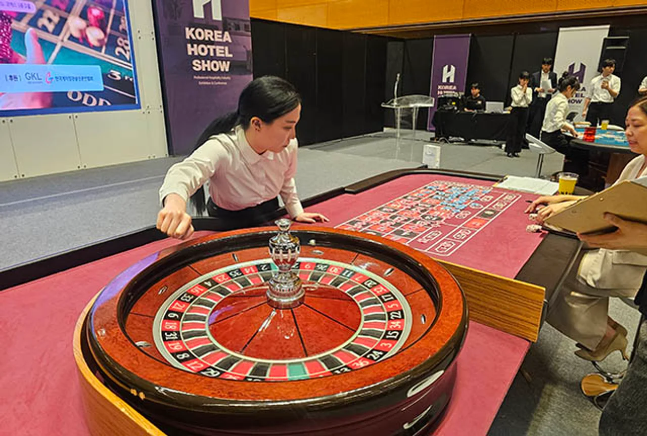 Casino Essentials Dealer demonstrating a roulette game.